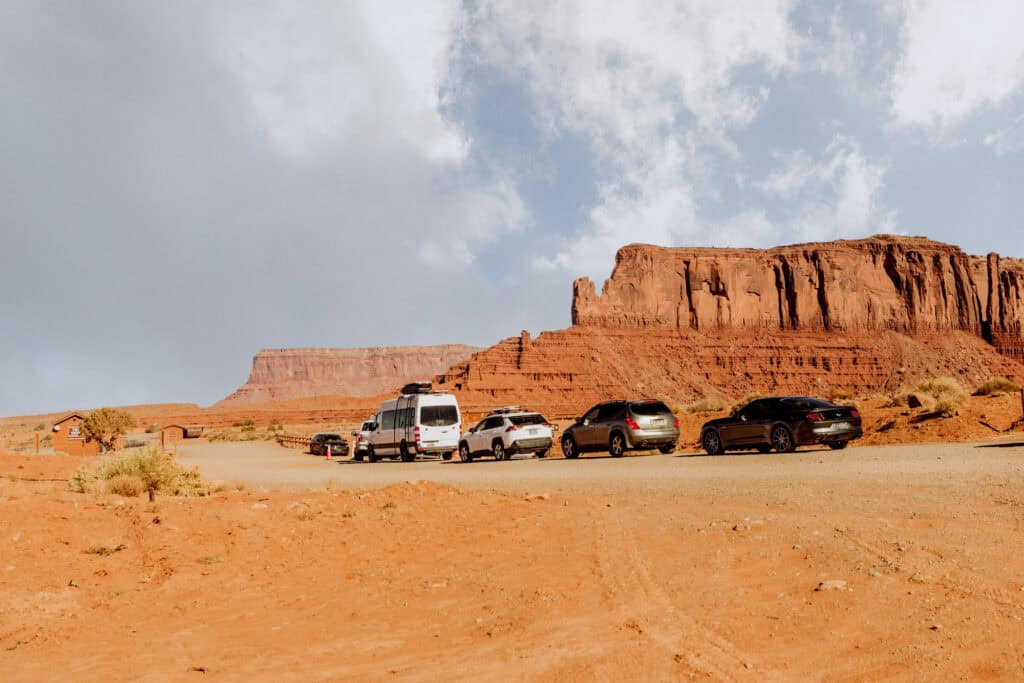 A line of cars about to drive through Monument Valley Navajo Tribal Park