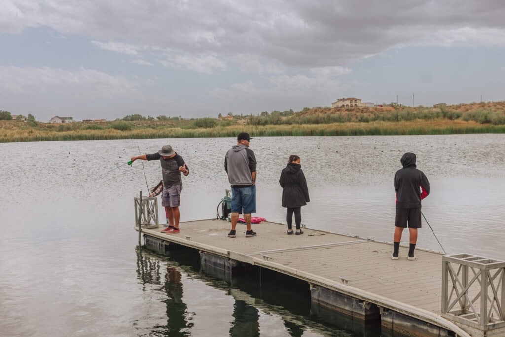 People fishing at Dankworth Pond State Park in Arizona