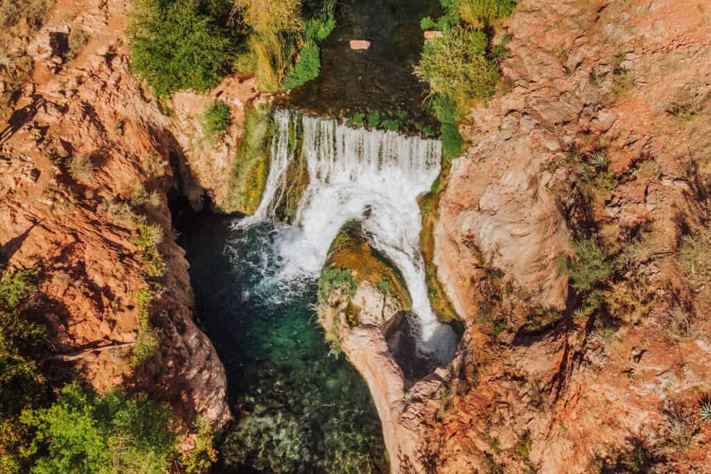 An areal drone view of the waterfall near Fossil Springs, Arizona