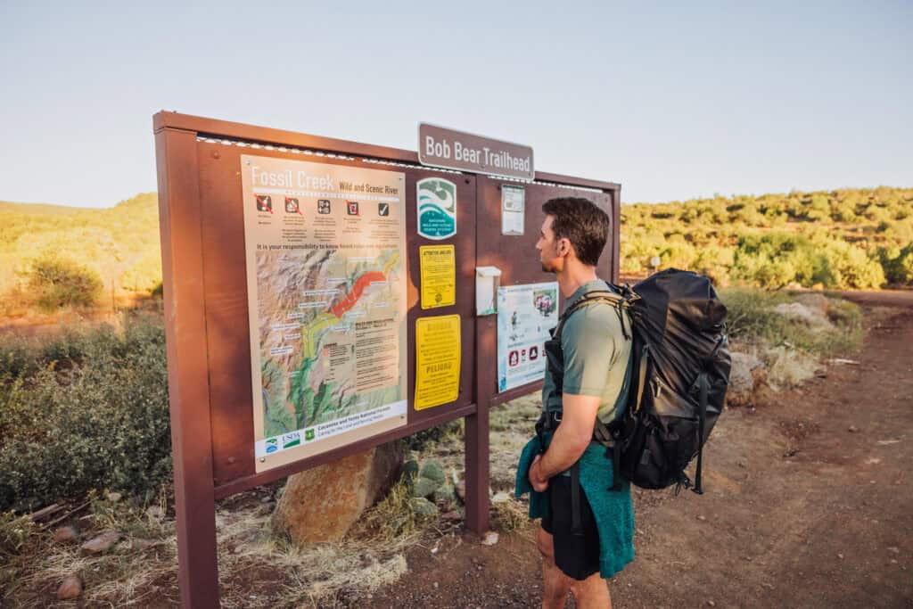 A hiker at the Bob Bear Trailhead to Fossil Springs