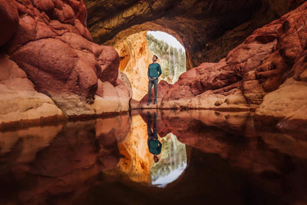 Jared Dillingham under the bridge at Tonto Natural Bridge near Payson, AZ