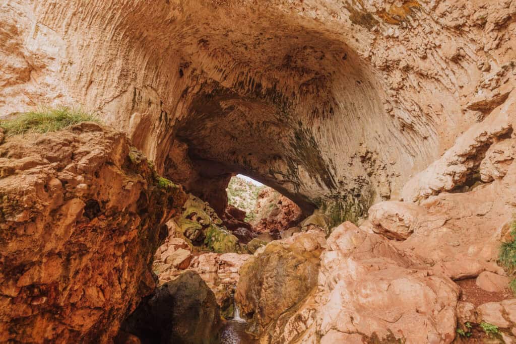 A wide-angle photo under Tonto Natural Bridge