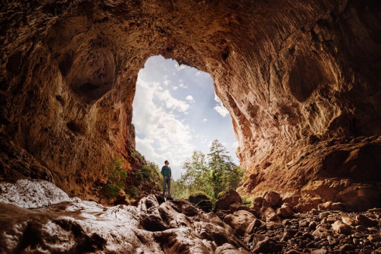 Jared Dillingham at Tonto Natural Bridge State Park, under the world's largest travertine stone bridge