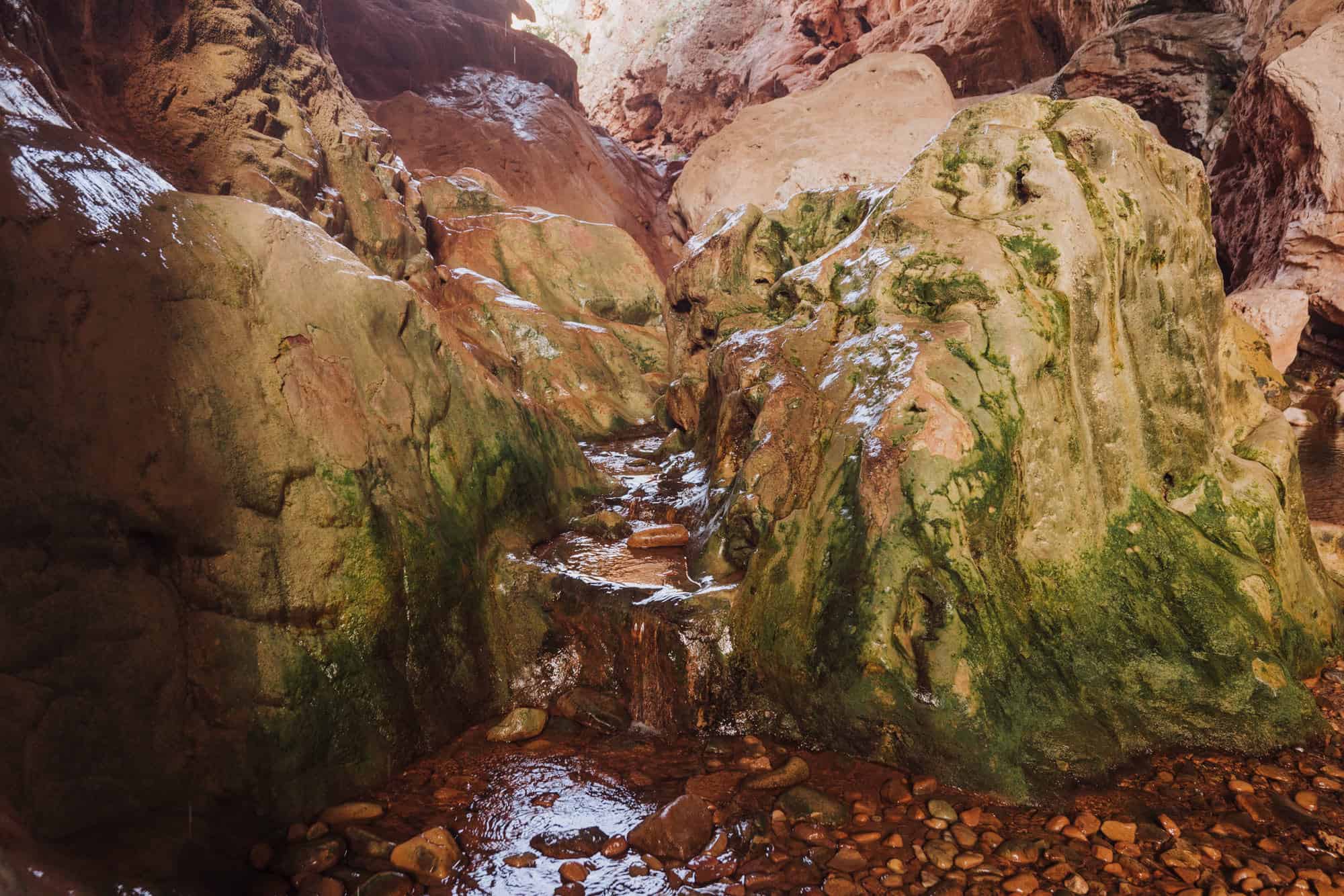 The rocks under Tonto Natural Bridge are slippery, but you'll see people of all ages making the hike through the tunnel