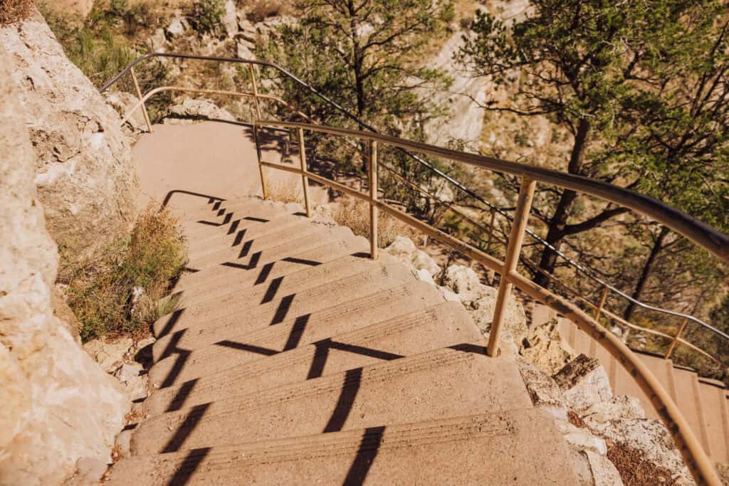 Hike the stairs down into Walnut Canyon