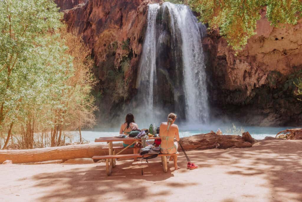 People having a picnic at the beach at the base of Havasu Falls