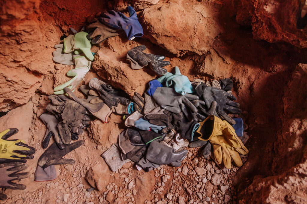 A pile of gloves left at Mooney Falls