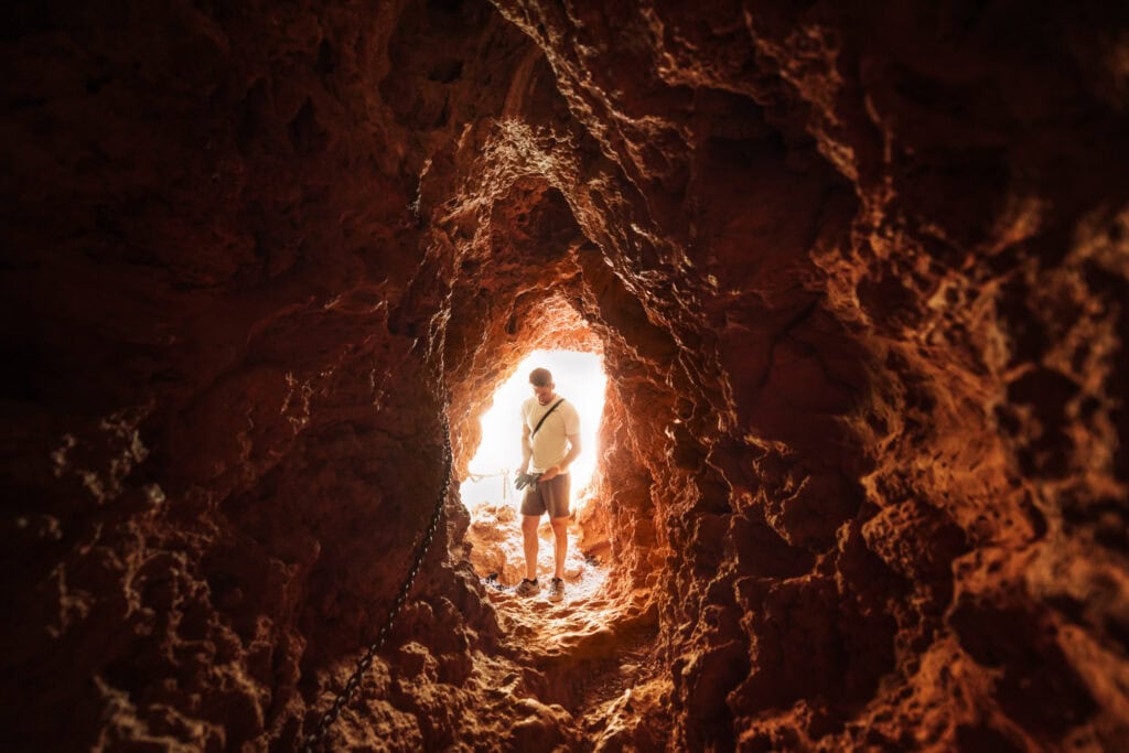 Jared Dillingham in the tunnel before climbing down Mooney Falls