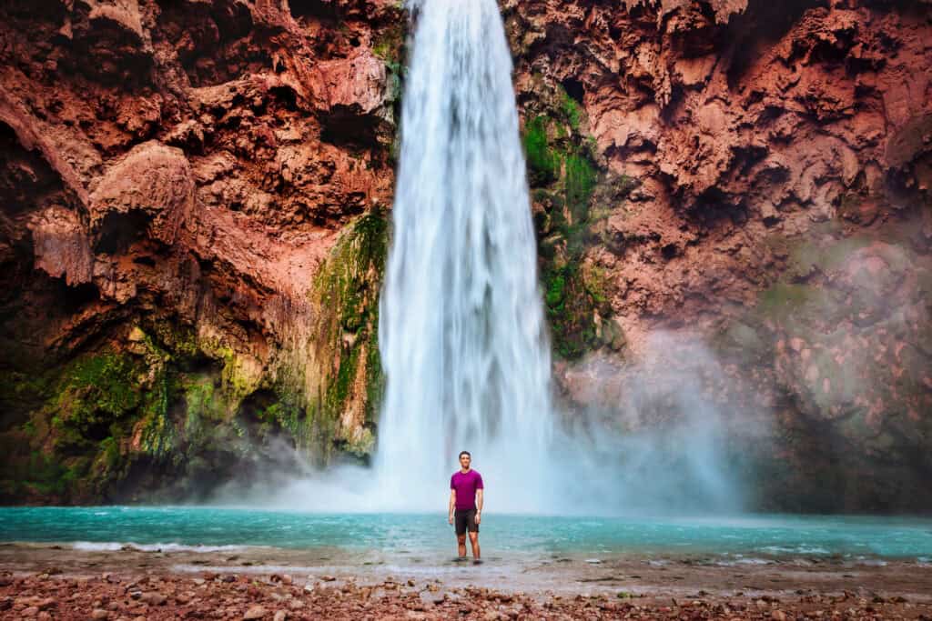 Jared Dillingham at the base of Mooney Falls, after climbing down the chains and ladders