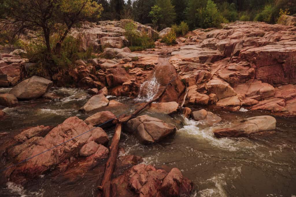 Hiking the trail across the creek that runs into Water Wheel Falls in Payson