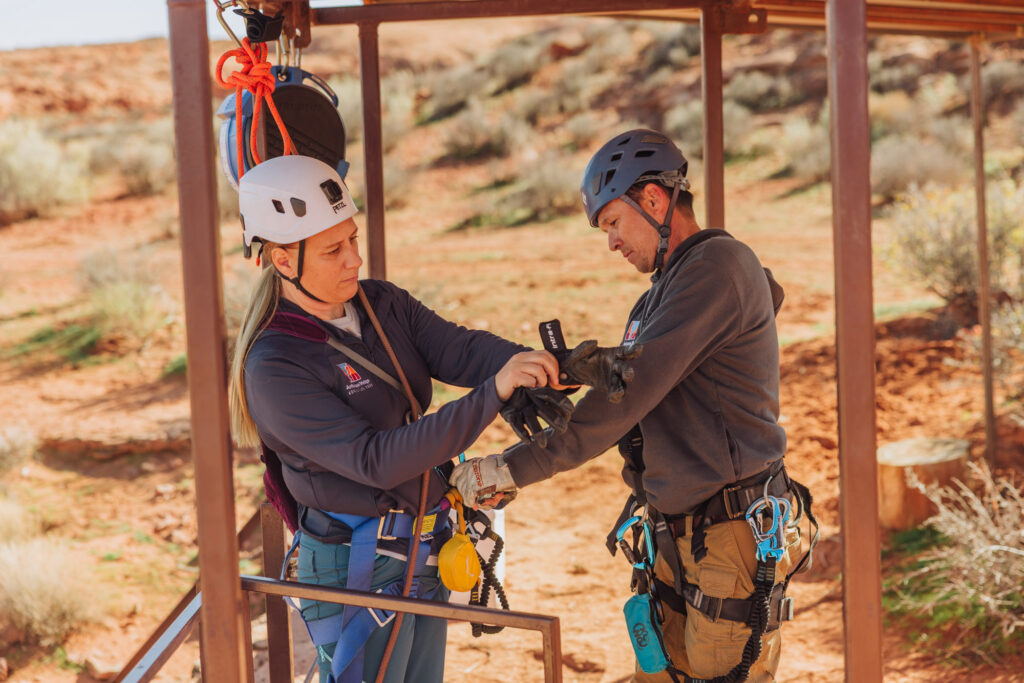 Getting fitted with rappelling harness helmet and gear