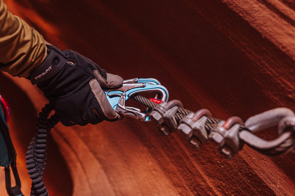 Clipped into the safety line on the via ferrata at Antelope Ridge