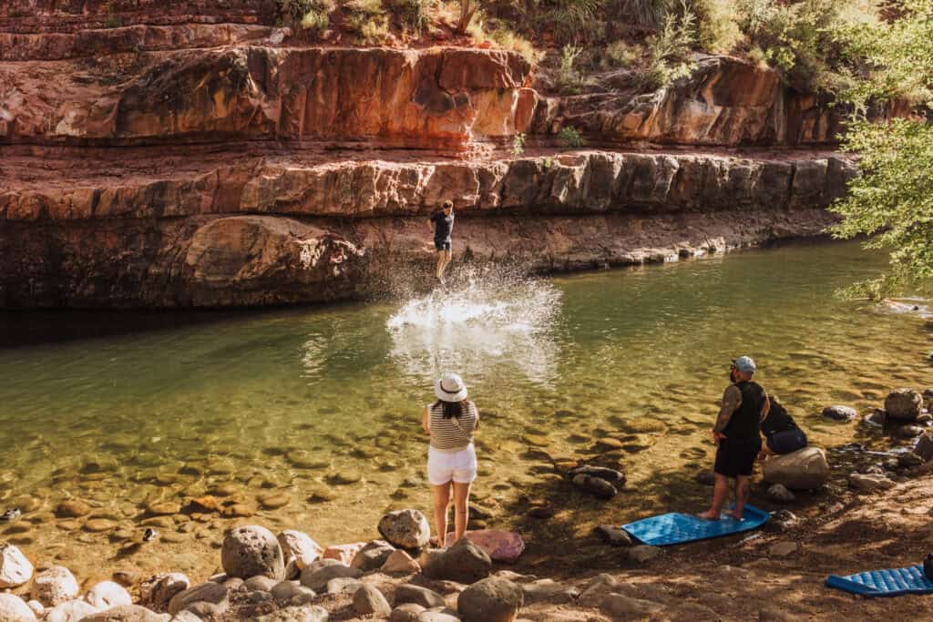 People swimming at Grasshopper Point in Sedona, AZ