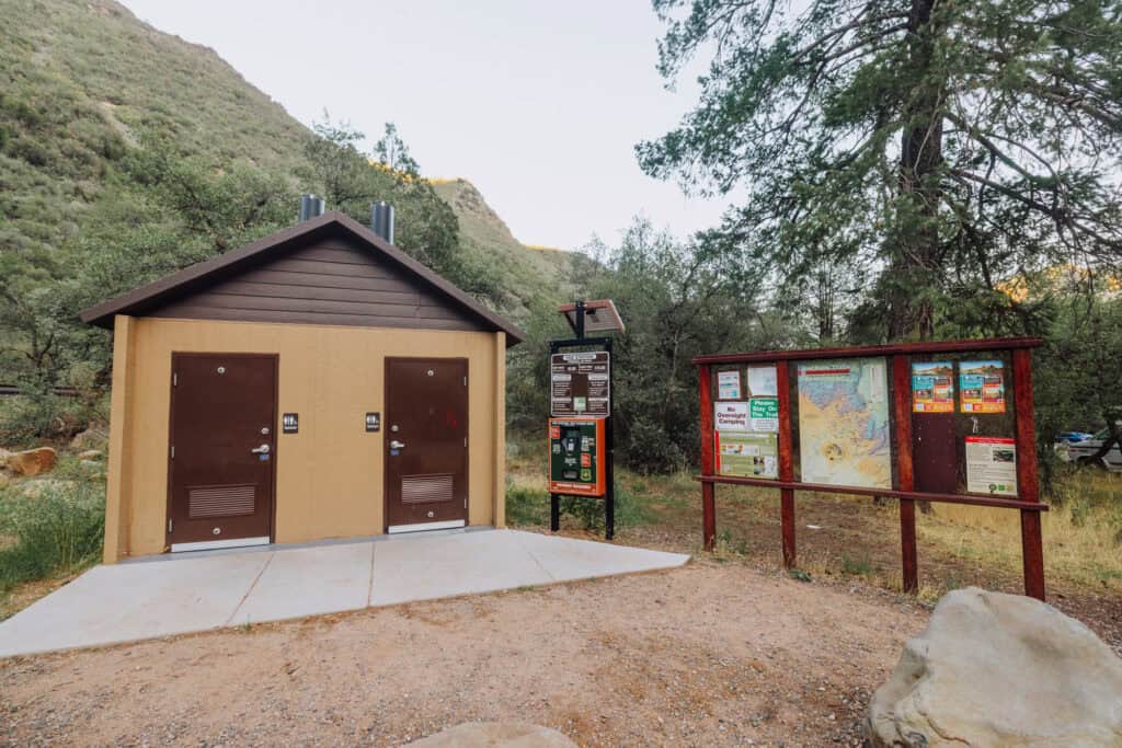 Bathrooms in the parking lot at Halfway Picnic swimming spot in sedona